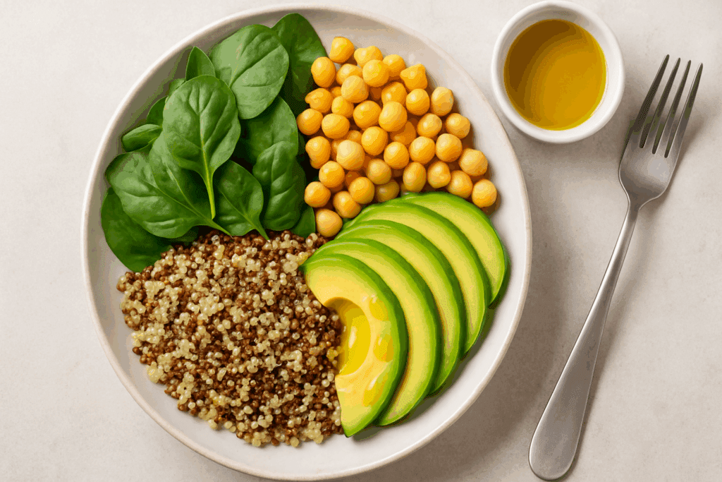 Smart and Satisfying Vegetarian Meals for Weight Loss: Expert-Backed Recipes to Help You Shed Pounds Naturally 3 Balanced plate of leafy greens, chickpeas, quinoa, and avocado slices with olive oil—an example of vegetarian meals for weight loss